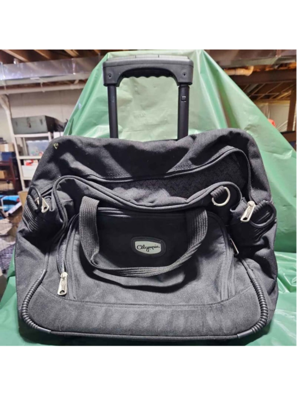 Olympia 22" Black 8 Pocket Rolling Duffel Bag Retractable Handle